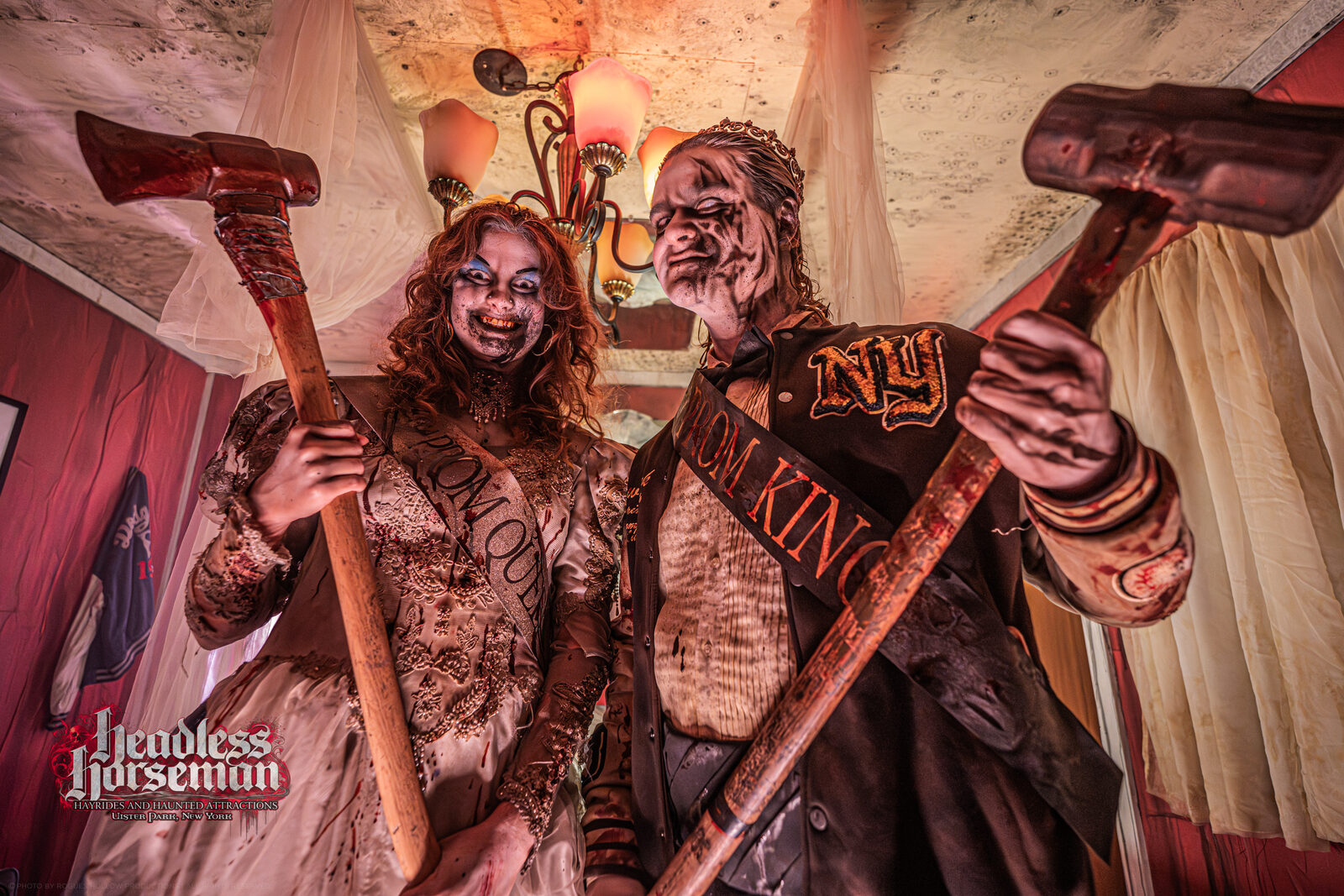Undead prom king and queen actors with axes inside a haunted house at Headless Horseman in the Hudson Valley
